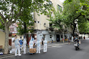 Residents line up for nucleic acid testing, amid the coronavirus disease (Covid-19) outbreak, in Shanghai, China May 11, 2022. 