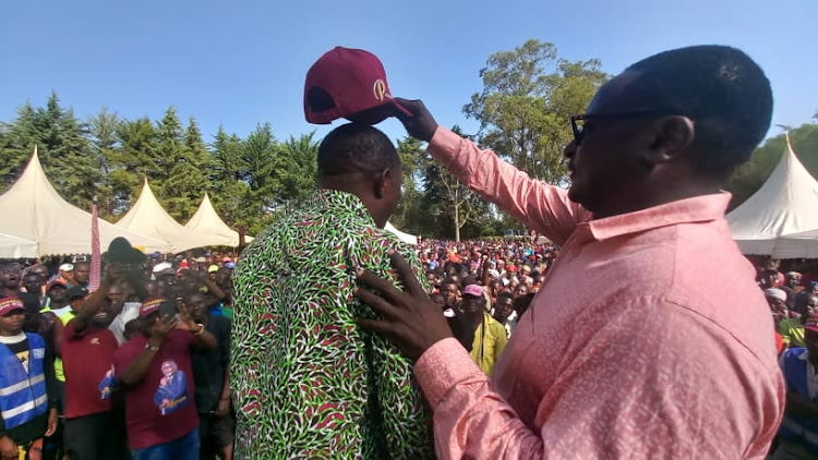 Vihiga Deputy Governor Patrick Saisi is welcomed to UDP party by Senator George Khaniri.