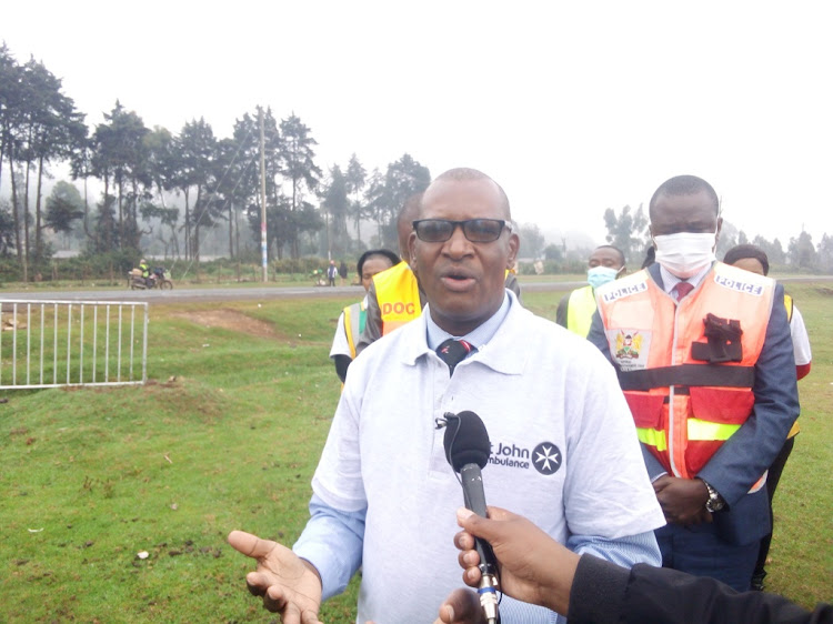 St John Ambulance chief executive Harun Gikera speaking to journalists at Nyambare trading centre in Lari sub county