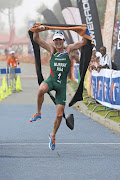 Richard Murray jumps for joy as he crosses the finish line first in a race in East London in 2014.