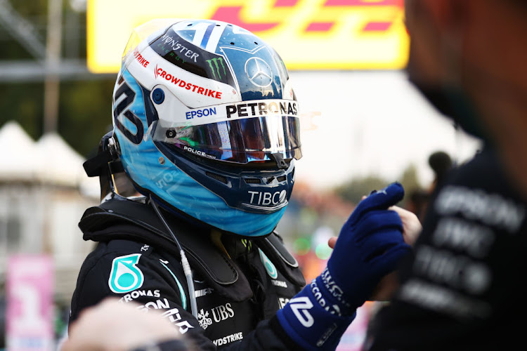 Pole position qualifier Valtteri Bottas celebrates in parc ferme during qualifying ahead of the F1 Grand Prix of Italy at Autodromo di Monza on September 10, 2021 in Monza, Italy.