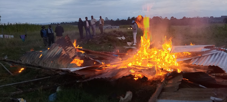 Residents of Canaan Estate, Ol Kalou town, at the scene where the house of a suspected bhang peddler was torched on Sunday, September 20, 2020.