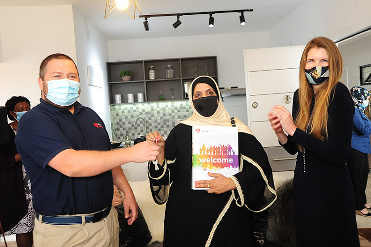 L-R:Unity Homes Executive Director John Latham, Home Owner Zabin Mohammed and British High Commissioner (Kenya) Jane Marriott/COURTESY