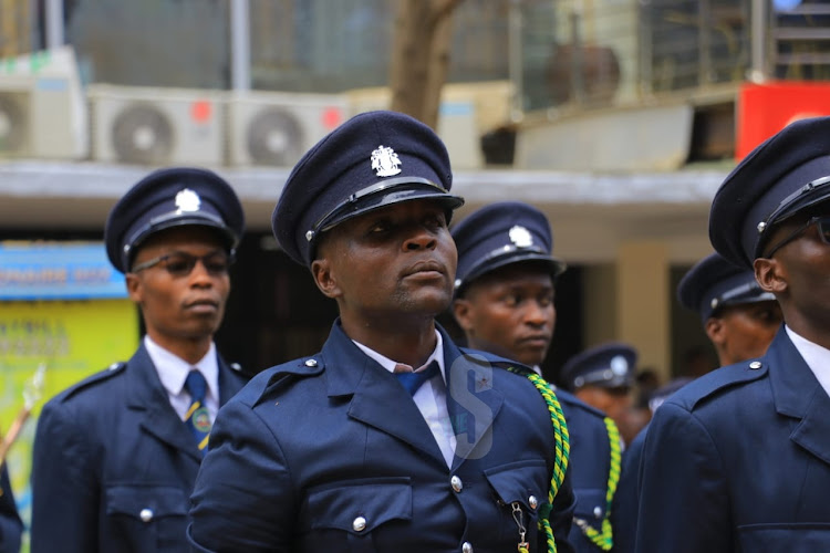 Officers from Nairobi City County inspectorate await the arrival of Governor Johnson Sakaja ahead of his County Assembly address on the status of the county on April 4, 2024