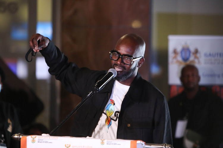 Internationally acclaimed DJ Black Coffee greets fans after arriving, 05 April 2022, at Or Tambo International Airport, in Kempton Park, after winning his first grammy award in Las Vegas.