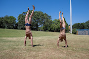 Pieter Coetzé and Matthew Sates do handstands as part of their training in Pretoria earlier this year. 