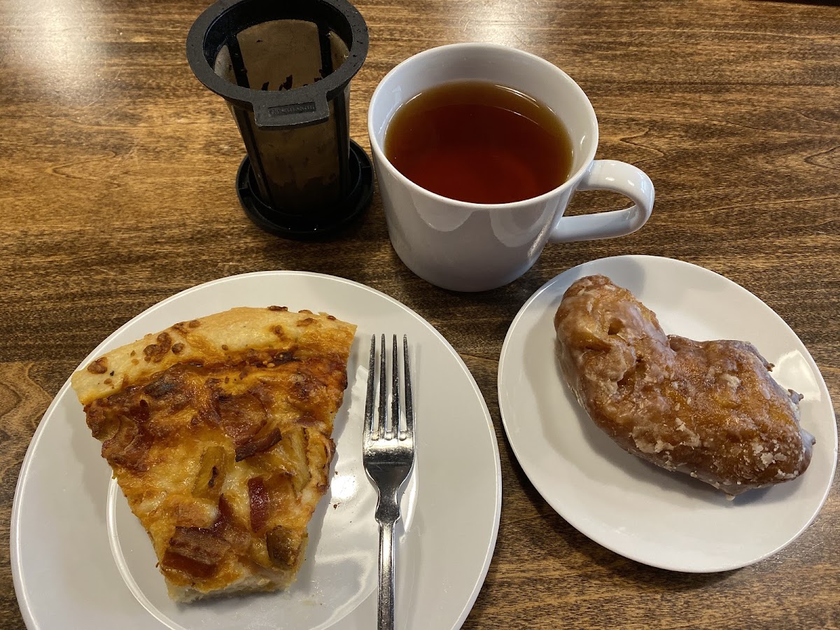 Slice of pizza and Apple Fritter with tea.