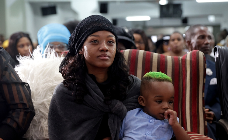 Bongekile 'Babes Wodumo' Simelane and her son during the funeral service for her husband Mandla 'Mampintsha' Maphumulo.