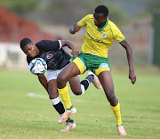 Tlotlego Pitso of Hungry Lions and Tshepho Mashiloane of Baroka FC during the Motsepe Foundation Championship match on November 04