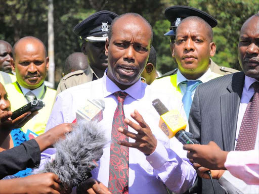 YOU MUST COMPLY:: NTSA chairman Lee Kinyanjui, director general Francis Meja and police officers address the media in Nairobi yesterday.