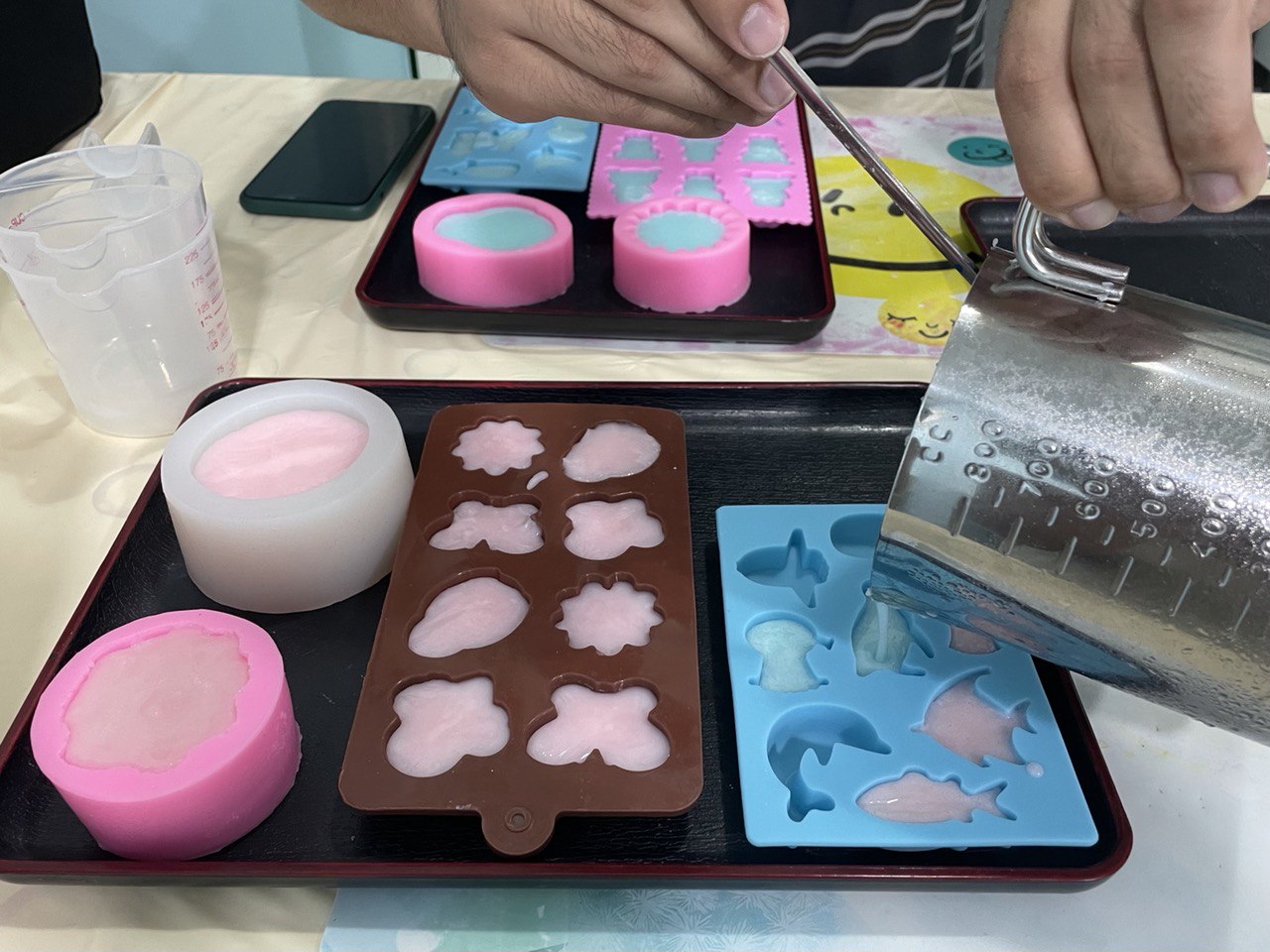 pouring the soaps into the mould 