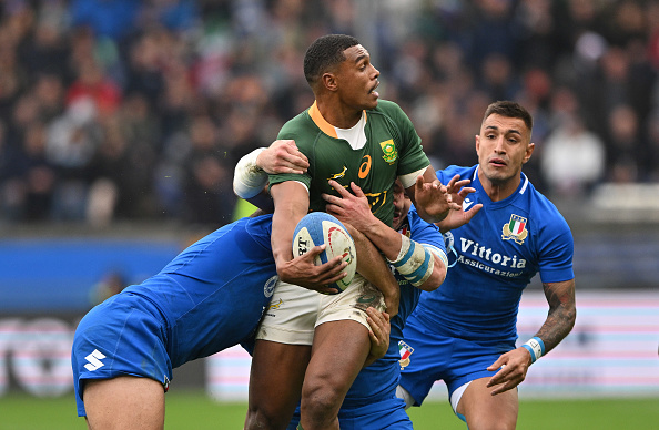 Damian Willemse of South Africa tackled by Giacomo Nicotera of Italy during their Autumn International clash at Stadio Luigi Ferraris on November 19, 2022 in Genoa, Italy.