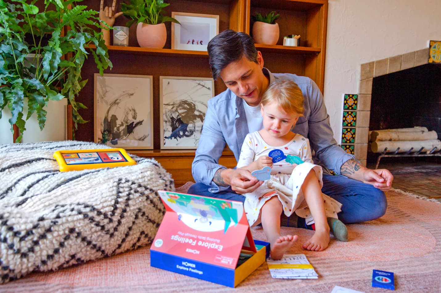 Parent playing HOMER Exploring Feelings game with his child