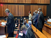 Former Gauteng health department officials Sybil Ngcobo, Mmakgosi Mosupi, Valdis Ramaano and Obakeng Mookeletsi appear in court on Thursday. They face charges of corruption and contravention of the Public Finance Management Act.
