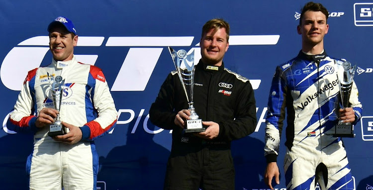 All Power Audi driver Simon Moss (centre) celebrates his race one victory ahead of championship rival Keagan Masters (VW Motorsport) and Johan Fourie (BMW) at Zwartkops at the weekend.