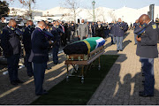 Mourners honour Shaleen Surtie-Richards with a moment of silence.