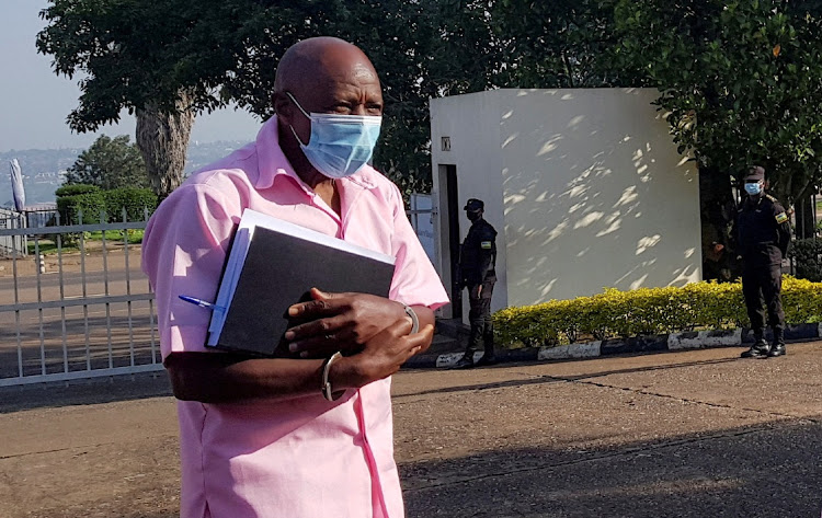 Paul Rusesabagina walks in handcuffs to a court in Kigali, Rwanda, February 26 2021. Picture: CLEMENT UWIRINGIYIMANA/REUTERS