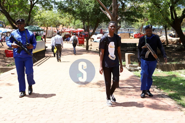 Police officers deployed to improve security following increased cases of muggings and stabbings in the city patrol Green Park Terminus area, Nairobi on November 21, 2022.