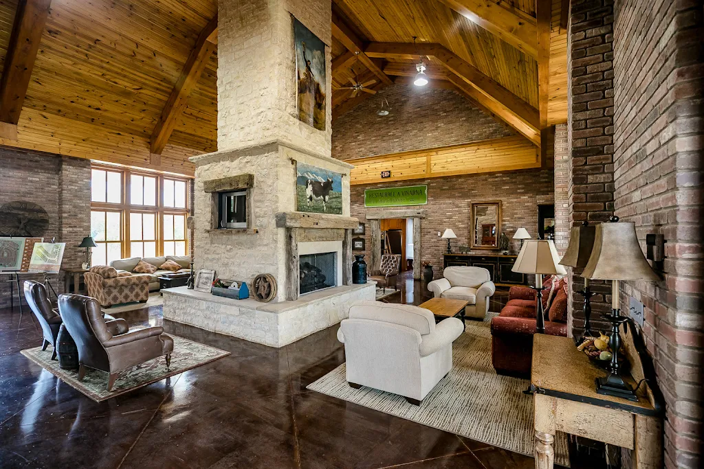 Clubhouse with couches, chairs, and fireplace