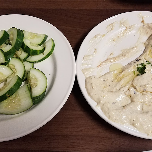 Well-enjoyed baba ganoush with cucumber slices