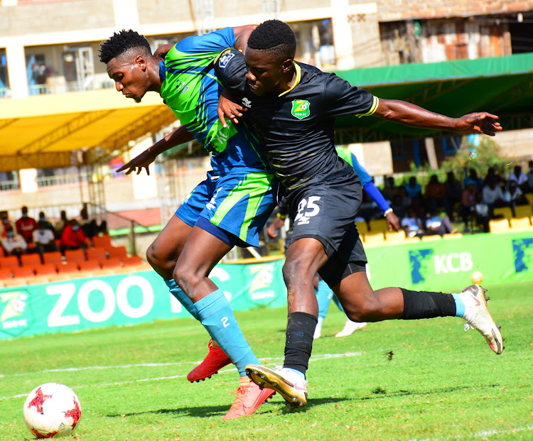 Mathew Tayo of Zoo Kericho vies for the ball with KCB's Rama Mwenda during a past Kenyan Premier League match at Utalii Sports Club