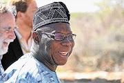 BIG WIGS: Nicky Oppenheimer and Olusegun Obasanjo share a joke during a meeting hosted by the Brenthurst Foundation