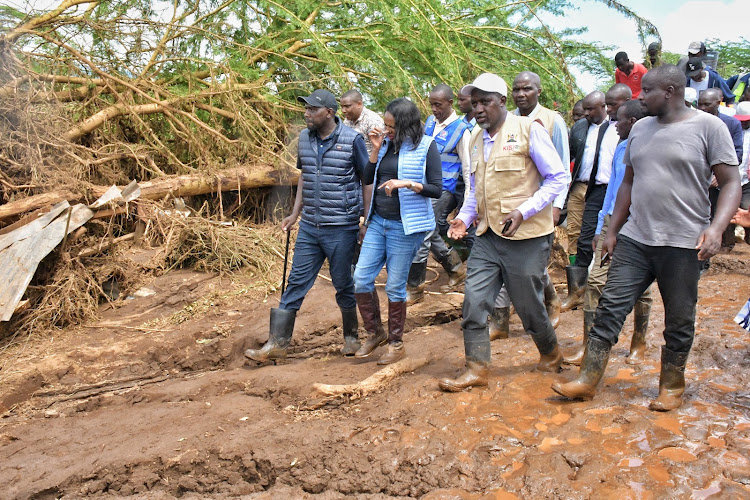 Transport CS Kipchumba Murkomen and Nakuru Governor Susan KIhika at the scene of the burst dam.