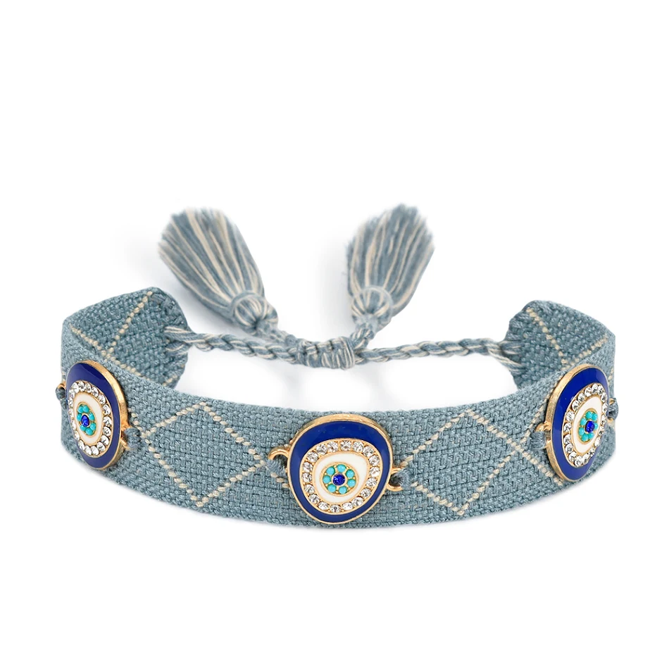 Lucky Blue Eyes Trendy Geweven Armband. Ervaar geluk en stijl met deze modieuze geweven armband. Perfect voor dagelijks gebruik en een unieke uitstraling.