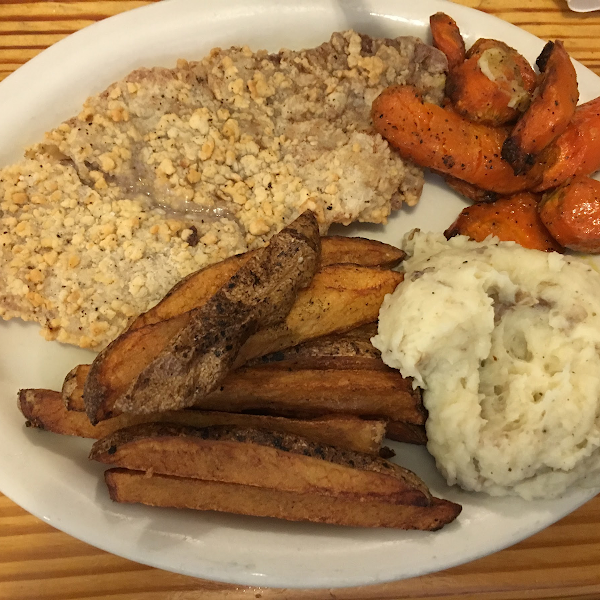 Lunch special with Gluten free chicken fried steak (gf cream gravy on the side) mashed potatoes, fries and roasted carrots