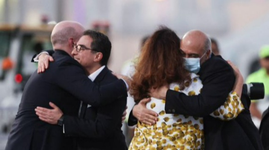 The five American citizens and their families shook hands and exchanged hugs with Qatari and American officials as they disembarked from the plane in Doha.