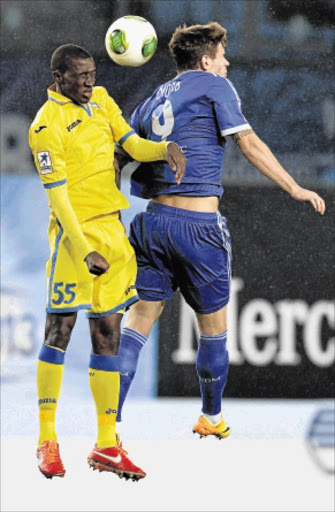 TALL ORDER: Bafana Bafana and FC Rostov defender Siyanda Xulu, left, fights for the ball with FC Dinamo Moscow's Fyodor Smolov during their Russian Premier League game at the Arena Khimki Stadium in Khimki, Russia Photo: Epsilon/Getty Images