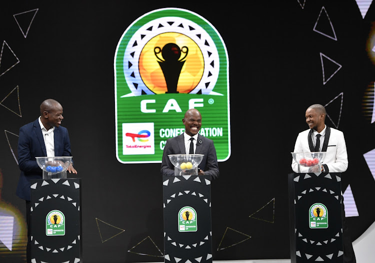 Hlompho Kekana, programme director Thomas Mlambo and Rainford Kalaba all smiles during the Caf Confederation Cup draw at SuperSport Studios in Johannesburg.