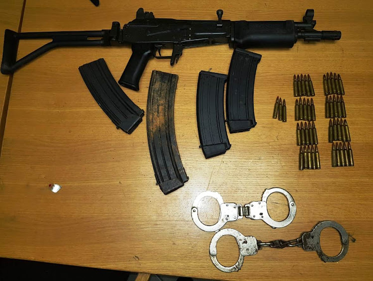 An R5, ammunition and handcuffs seized on June 12 2019 by anti-gang unit members patrolling Happy Valley, Cape Town.