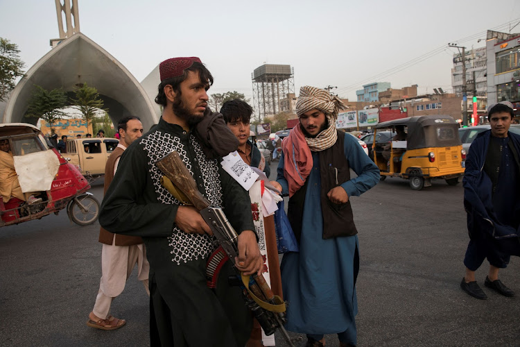 Taliban soldiers in the streets of Herat, where former Taliban leader Mawlawi Mahdi was shot dead.