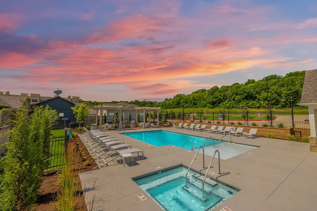 Pool surrounded by chairs 