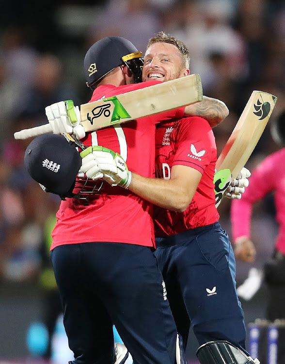 Alex Hales of England and Jos Buttler of England embrace as England wins the match during the ICC Men's T20 World Cup Semi Final match between India and England at Adelaide Oval on November 10 2022. Picture: Sarah Reed/Getty Images