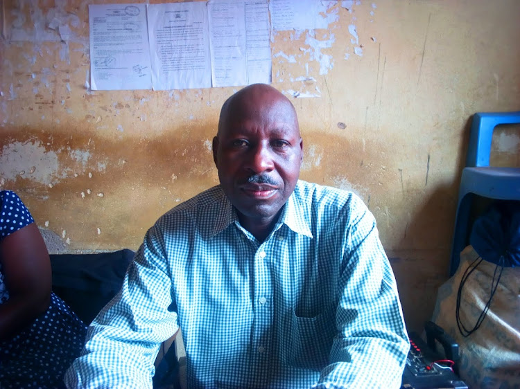 Simon Njeta, head of county askaris in Luanda subcounty, in his office at Luanda town