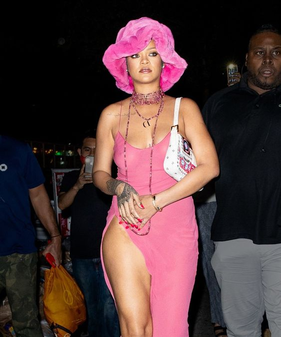 Rihanna wearing pink fur bucket hat on a matching dress