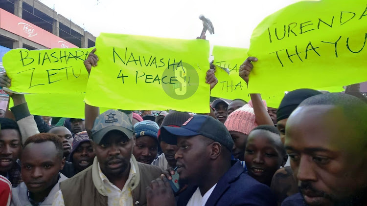 Naivasha residents hold peaceful demonstrations urging area traders to continue with their business after calls by the opposition for mass action on March 20, 2023.