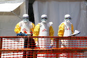 Health workers dressed in protective suits are seen at the newly constructed MSF (Doctors Without Borders) Ebola treatment centre in Goma, Democratic Republic of Congo, on August 4 2019.