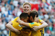 Belgium's Eden Hazard celebrates scoring their second goal with Kevin De Bruyne and Dries Mertens.   