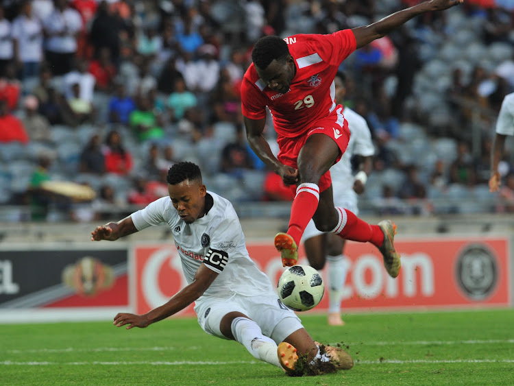 Orlando Pirates' centre-back and captain Happy Jele (L) makes a match-saving tackle to block Nekundi Panduleni of African Stars during the Caf Champions League match at Orlando Stadium in Orlando, Soweto, on December 15 2018. Sydney Mahlangu/BackpagePix