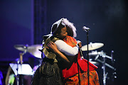 South African vocalist Zolani Mahola shares an emotional moment with Vocalist Mandisa Dlanga after performing the popular song Asimbonanga with the Soweto Gospel Choir.