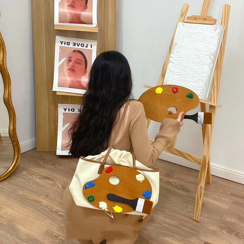 Schoudertas voor kunstenaars met design, kleur en schilderbord. Ideaal voor het gemakkelijk vervoeren van kunstbenodigdheden.