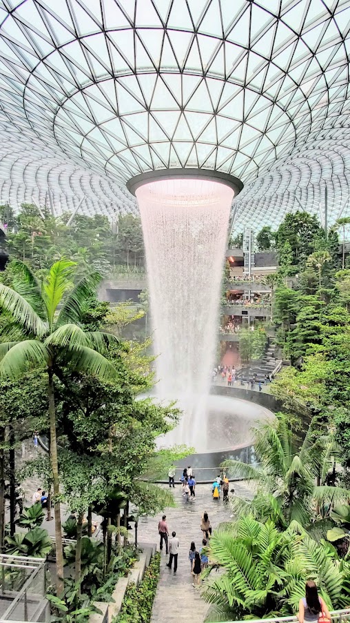 Visiting Changi Airport in Singapore: the famous HSBC Rain Vortex and the surrounding Shiseido Forest Valley - four stories of greenery surrounding the world's tallest indoor waterfall