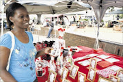 LOVING MOOD: Nomalanga Moyo buys a Valentine's gift for her husband in Randburg. Pic: Mohau Mofokeng . 14/02/2010. © Sowetan.