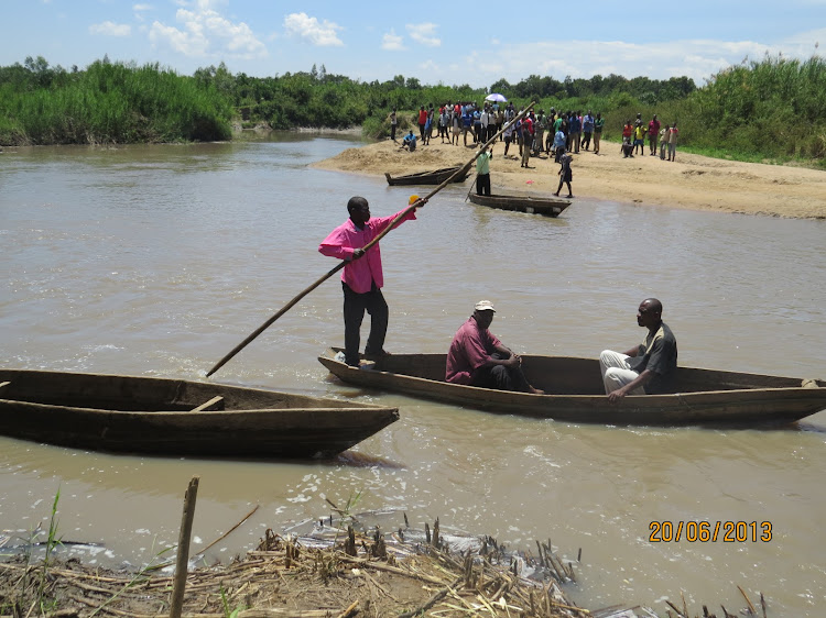 Local divers search for the body of Bernard Oduor in River Nzoia