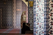 Women pray salah and recite the Quran during the Muslim holy month of fasting, Ramadan, at the Nizamiye Mosque in Johannesburg on June 21, 2017.  The mosque was completed in 2012 and is an adaption of the 16th-century Ottoman Selimiye Mosque which is situated in Erdine, Turkey and it, including the school, museum and shopping complex situated in Midrand is a significant marking of the Turkish community's contribution to the South African landscape.  The community also hosts mass iftars (breaking of the fast) every night, hamper and food distributions among other projects for the entire duration of Ramadan