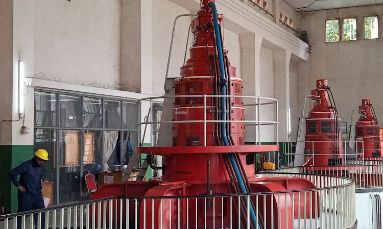 A technician from the Societe Nationale d'Electricite is seen during the maintenance on a turbine clogged with plastic waste that landed at the entrance to the Ruzizi I hydroelectric