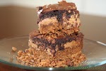 Ultimate Pretzel Crusted Peanut Butter Cookie Candy Brownie Bars was pinched from <a href="https://www.babygizmo.com/2012/02/ultimate-pretzel-crusted-peanut-butter-cookie-candy-brownie-bars/" target="_blank">www.babygizmo.com.</a>